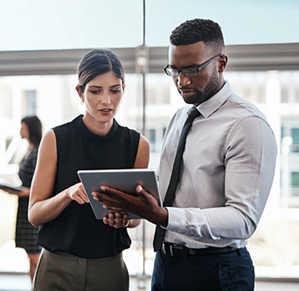 business people looking at tablet